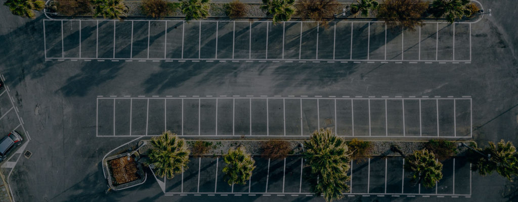 Empty Parking Lot, Showing Low Inventory