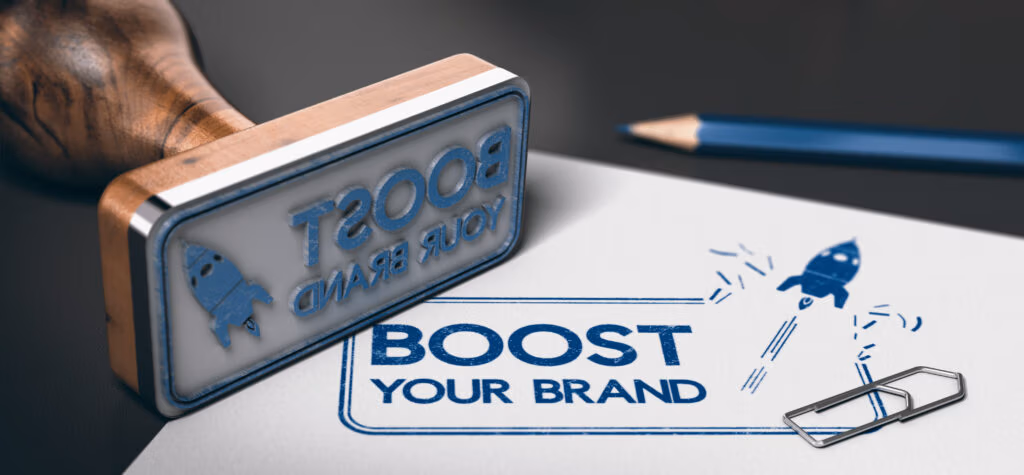 stamping "boost your brand" on papers